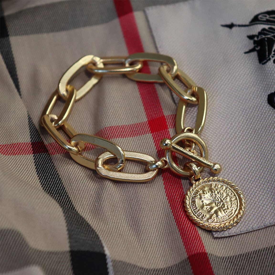 Elongated link layering bracelet with coin charm dangle