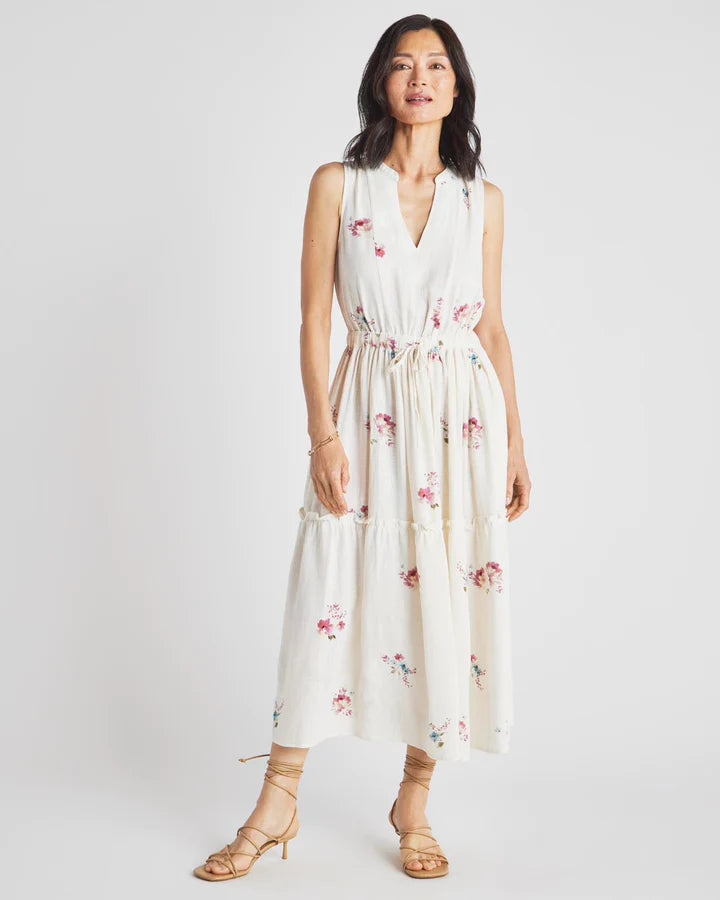 Delicate Floral print dress with split collar, drawstring waist, tiered skirt, front pockets and linen blend.